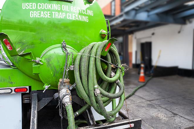 a service truck pumping grease from a restaurant's grease trap in Monterey Park